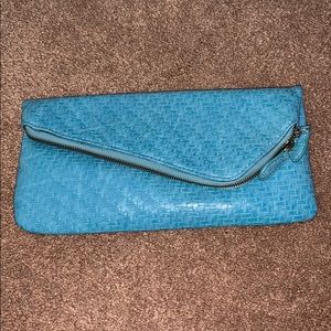 Capelli fold over zipper clutch